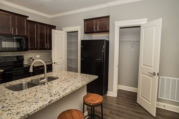 Kitchen with granite countertop and sink